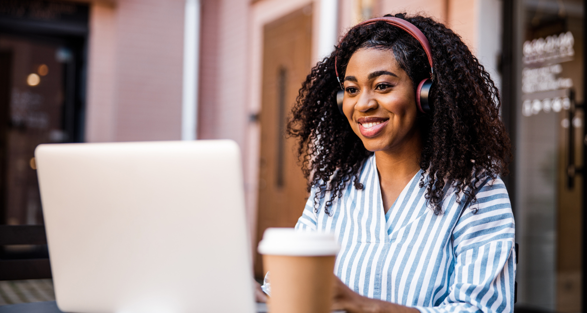 Woman smiling during a video coaching session